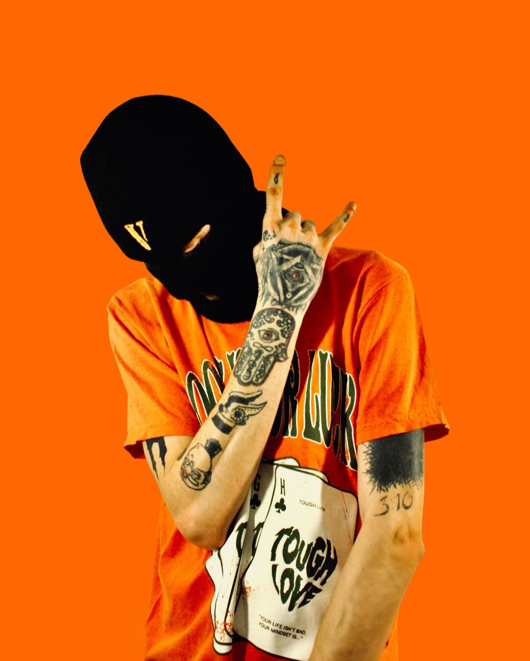 Jay Honest photoshoot featuring VLONE balaclava and Tough Love Crew t-shirt