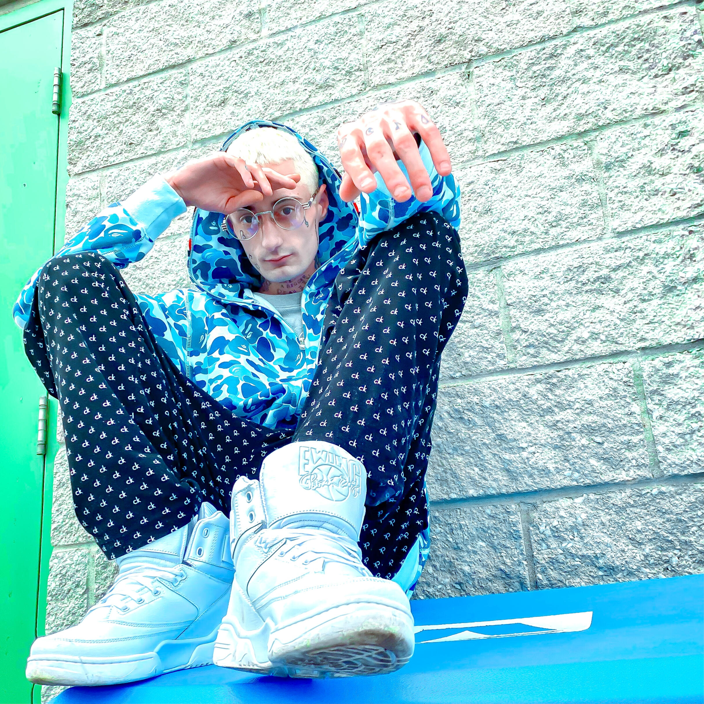 Jay Honest in a baby blue Bape sweater